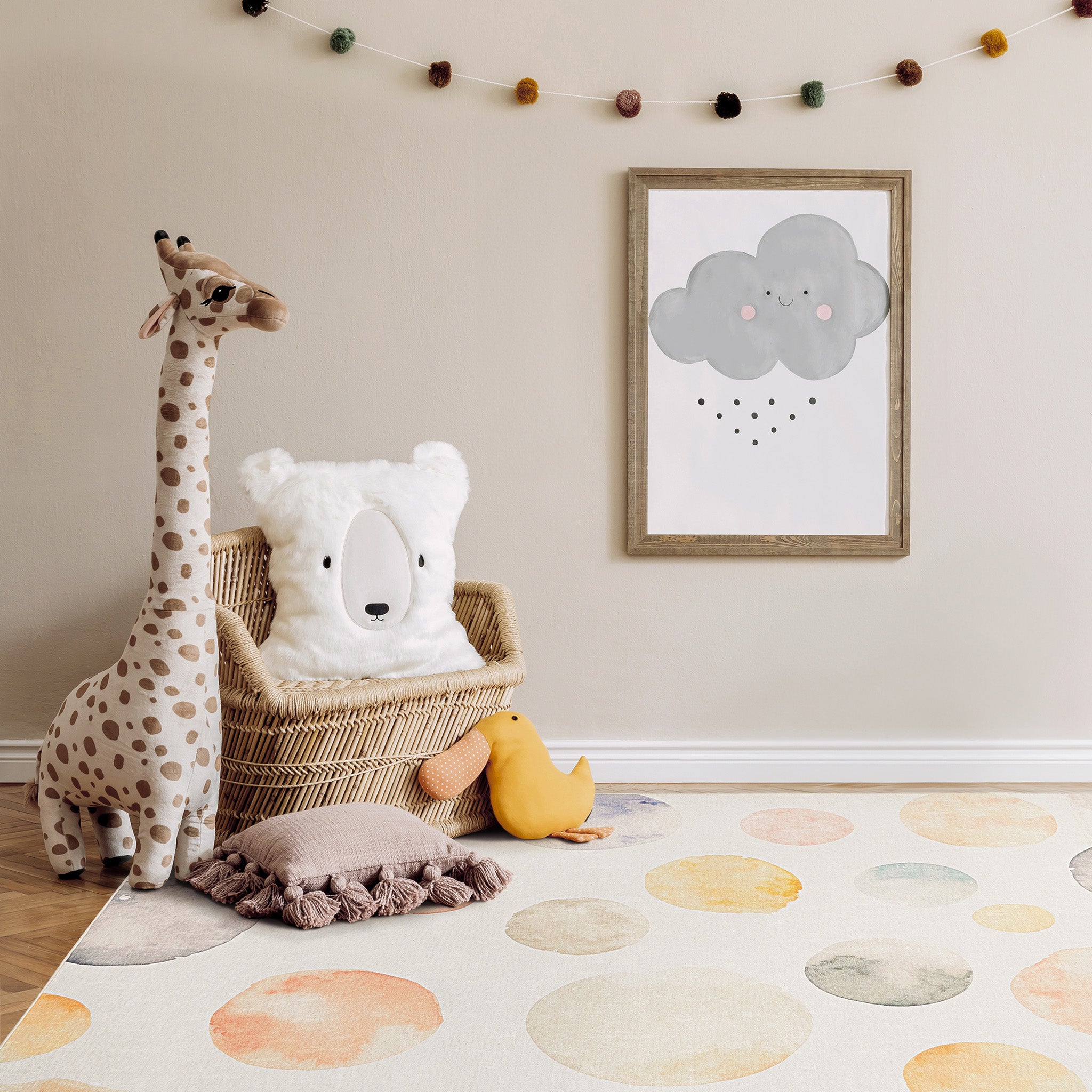 Children's playroom with art wall, wooden arch climber, and toy kitchen.