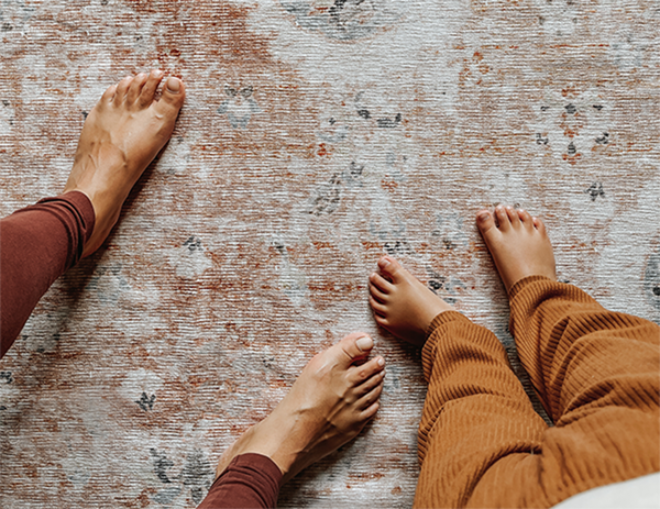 women with child on washable rug