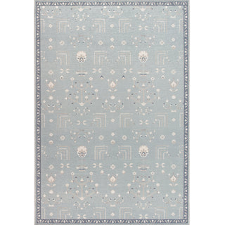 A rectangular rug with a traditional Persian design featuring the Tree of Life motif. The rug has a sea blue and ivory color palette with a subtle texture.